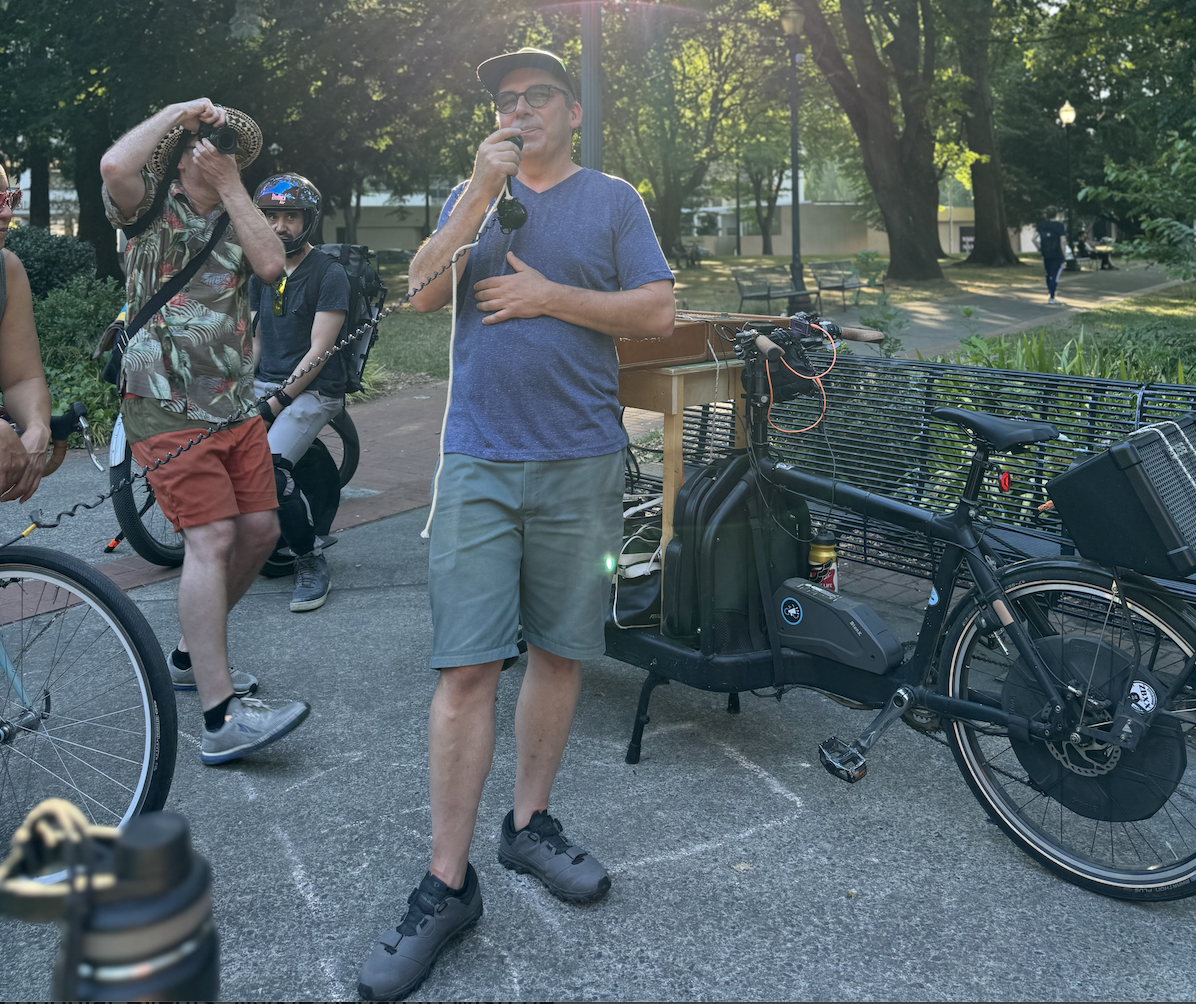 Bleeps and Bloops Ride Leader addressing the cyclists